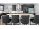 Modern kitchen featuring a spacious island with barstool seating, ideal for entertaining at 4515 Lions Gate Ave, Clermont, FL 34711