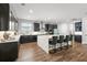 Gourmet kitchen with a large island, granite countertops, and stainless steel appliances at 4515 Lions Gate Ave, Clermont, FL 34711
