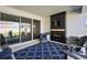 Outdoor patio with fireplace, television, large rug, and comfortable seating, perfect for entertaining at 4515 Lions Gate Ave, Clermont, FL 34711