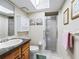 The bathroom features a walk-in shower, vanity with sink, and a mirrored medicine cabinet at 500 Newell Hill Rd # 111A, Leesburg, FL 34748