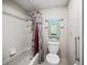 Inviting bathroom with a combination tub and shower, decorative shower curtain and modern fixtures at 500 Newell Hill Rd # 111A, Leesburg, FL 34748