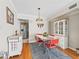 Charming dining room features a vintage table set and hardwood floors at 500 Newell Hill Rd # 111A, Leesburg, FL 34748