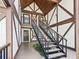 Exterior stairs to a unit featuring Tudor-style accents, mailbox, light fixture, and door at 500 Newell Hill Rd # 111A, Leesburg, FL 34748