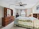 Tranquil primary bedroom featuring tiled floors, a ceiling fan, and neutral decor for a calming retreat at 500 Newell Hill Rd # 111A, Leesburg, FL 34748