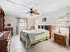 Cozy primary bedroom with a ceiling fan, neutral walls, and tiled floors, creating a relaxing atmosphere at 500 Newell Hill Rd # 111A, Leesburg, FL 34748