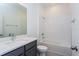 This bathroom features a single sink vanity, toilet, and bathtub with shower at 5024 Balsam Falls Rd, Deland, FL 32724
