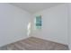 This bedroom features a neutral color palette and one window for natural light at 5024 Balsam Falls Rd, Deland, FL 32724