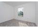 This bedroom features a neutral color palette and one window for natural light at 5024 Balsam Falls Rd, Deland, FL 32724
