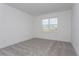 This bedroom features a neutral color palette and one window for natural light at 5024 Balsam Falls Rd, Deland, FL 32724