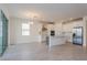 Spacious open floor plan with a modern kitchen, stainless steel appliances, and a cozy dining area at 5024 Balsam Falls Rd, Deland, FL 32724