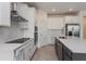 Contemporary kitchen with white countertops, stainless steel appliances, an island, and a herringbone backsplash at 5024 Balsam Falls Rd, Deland, FL 32724