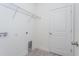 A basic laundry room features shelving for extra storage at 5024 Balsam Falls Rd, Deland, FL 32724