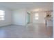 Spacious open-concept living area with modern kitchen, dining space, and large windows for natural light at 5024 Balsam Falls Rd, Deland, FL 32724