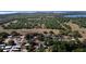 An aerial view showcases the home's location among lush greenery and nearby lakes at 5029 Eagles Nest Rd, Fruitland Park, FL 34731