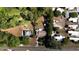 An aerial view displaying the property and surroundings with mature trees at 5029 Eagles Nest Rd, Fruitland Park, FL 34731