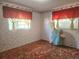 Bedroom featuring unique wallpaper and window treatments with curtains at 5029 Eagles Nest Rd, Fruitland Park, FL 34731