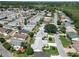 Spacious community with well-maintained homes, green lawns, and mature trees at 508 Carrera Dr, The Villages, FL 32159