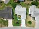 An aerial view displaying the house and its well manicured lawn at 508 Carrera Dr, The Villages, FL 32159