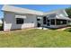 Well-maintained backyard with grill, patio, and landscaped garden beds, perfect for outdoor living at 508 Carrera Dr, The Villages, FL 32159