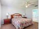 Bright main bedroom with en suite access and soft lighting from the side table lamps at 508 Carrera Dr, The Villages, FL 32159