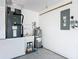 Utility room with water heater, sink and an electric panel, ensuring convenience at 508 Carrera Dr, The Villages, FL 32159