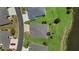 Aerial view showcasing the home's layout, landscaping, and proximity to the lake at 5220 Horsford Path, The Villages, FL 32163