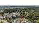 Aerial view of the community, showcasing the home's location near a serene lake at 5220 Horsford Path, The Villages, FL 32163