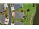 Aerial view showcasing the home's layout, landscaping, and proximity to the lake at 5220 Horsford Path, The Villages, FL 32163