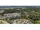 Aerial view of the community, showcasing the home's location near a serene lake at 5220 Horsford Path, The Villages, FL 32163