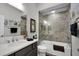 Modern bathroom featuring a glass-enclosed tub-shower and stylish decor at 5220 Horsford Path, The Villages, FL 32163
