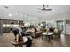 Open floor plan showcases living room with tile floors and comfortable sofas at 5220 Horsford Path, The Villages, FL 32163