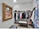 Large walk-in closet with ample storage space and clothing racks at 5220 Horsford Path, The Villages, FL 32163