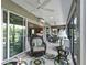 Bright sunroom featuring expansive windows, wicker furniture, and an inviting atmosphere at 575 Wheelock St, The Villages, FL 32163