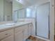 Bathroom with frosted glass shower and vanity at 633 Jameston Ave, The Villages, FL 32162