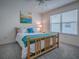 Inviting bedroom with natural light, a cozy rug, and a view of the outdoors at 633 Jameston Ave, The Villages, FL 32162