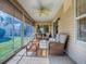 Relaxing sunroom featuring comfortable seating and scenic views of the outdoors at 633 Jameston Ave, The Villages, FL 32162