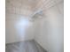 Empty walk-in closet with wire shelving and grey carpet at 633 Jameston Ave, The Villages, FL 32162