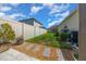 A backyard with a wood fence, landscaping, stone pavers, and stepping stones at 677 Brooks Field Dr, Winter Garden, FL 34787