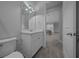 Bathroom with a white sink vanity, and a view to the open-concept kitchen at 677 Brooks Field Dr, Winter Garden, FL 34787