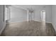 Bright bedroom showcasing wood-style tile flooring and shuttered windows for ample natural light at 677 Brooks Field Dr, Winter Garden, FL 34787