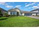 Charming single-story home featuring a well-manicured lawn, tasteful landscaping, and a convenient three-car garage at 677 Brooks Field Dr, Winter Garden, FL 34787