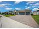 Inviting single-Gathering home featuring a well-manicured lawn and a spacious two-car garage at 677 Brooks Field Dr, Winter Garden, FL 34787