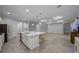 Open kitchen with island seating that connects to the living area at 677 Brooks Field Dr, Winter Garden, FL 34787
