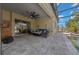 Covered lanai featuring a large fan, outdoor seating, and a view of the pool at 677 Brooks Field Dr, Winter Garden, FL 34787