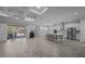 Open concept living area featuring a gourmet kitchen and access to the outdoor patio at 677 Brooks Field Dr, Winter Garden, FL 34787