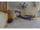 An outdoor patio area with tile floors, wicker furniture, and a ceiling fan at 677 Brooks Field Dr, Winter Garden, FL 34787