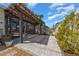 A large backyard patio area with pavers, a wooden pergola, and lush landscaping at 677 Brooks Field Dr, Winter Garden, FL 34787