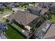 Aerial view of the home's rear exterior with a fenced yard, screened pool, and patio with pergola at 677 Brooks Field Dr, Winter Garden, FL 34787