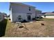 Spacious backyard with a swing set, patio and privacy fence at 6846 Wilson Hammock Ave, Groveland, FL 34736