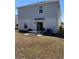 The backyard has a grill and bench for outdoor relaxation and entertainment at 6846 Wilson Hammock Ave, Groveland, FL 34736